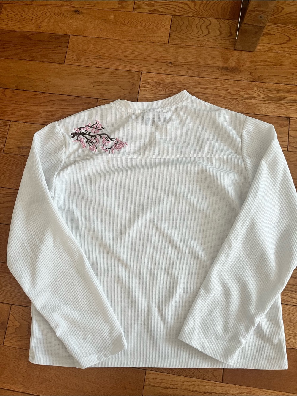 White Top with Red & Blue Graphic Neck Tag